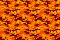 Camouflage pattern background. Classic clothing style masking camo repeat print. Fire orange brown yellow colors forest texture. D Royalty Free Stock Photo