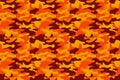 Camouflage pattern background. Classic clothing style masking camo repeat print. Fire orange brown yellow colors forest texture. D Royalty Free Stock Photo