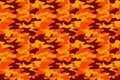 Camouflage pattern background. Classic clothing style masking camo repeat print. Fire orange brown yellow colors forest texture. D Royalty Free Stock Photo