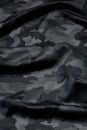 Camouflage pattern. Trendy dark gray camouflage fabric. Military texture. Dark back