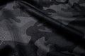 Camouflage pattern. Trendy dark gray camouflage fabric. Military texture. Dark back