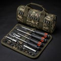 Camouflage-patterned tool bag and fabric tool roll containing various hand tools Royalty Free Stock Photo