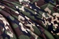 Camouflage textured fabric wavy background