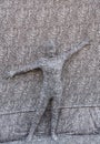 Camouflaged man artist performing on the street during street food festival