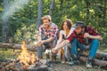 Camp adventure and travel concept. Company friends enjoy relaxing together in forest. Good day for spring picnic in Royalty Free Stock Photo