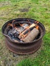 Camp fire in a truck wheel