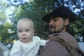 Camp follower with baby during historical Reenactment of Continental Army, Revolutionary War at Daniel Boon Homestead