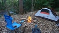 Camp kettle in the Blue Ridge Mountains in Asheville, North Carolina. Outdoor lifestyle with axe, cast iron skillet, flannel blan Royalty Free Stock Photo