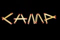 `Camp` spelled with matches, from side Royalty Free Stock Photo