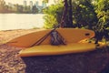 Camp of SUP surfers on the river bank next to a large city Royalty Free Stock Photo