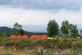 Camp tent area on the mountain. Red tents at the campsite. tourism concept