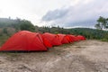 Camp tent area on the mountain. Red tents at the campsite. tourism concept