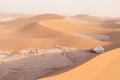 Camp with tent in the desert among sandy dunes. Sunny day in the Sahara during a sand storm in Morocco