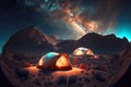 Camp with tourist tent against backdrop of starry sky and Milky Way mountains Royalty Free Stock Photo