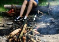 Camp tradition. Marshmallows on stick with bonfire and smoke on background. Holding marshmallow on stick. Roasty, toasty Royalty Free Stock Photo