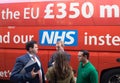 Campaign team in a discussion in front of the Vote Leave bus