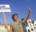 A campaign volunteer holding a sign