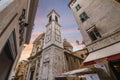 The campanile bell tower and Nice Cathedral at Place Rossetti past an apartment building as the sun sets in Old Town Nice Franc
