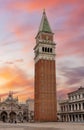 Campanile bell tower on St. Mark`s square in center of Venice at sunrise, Italy