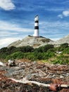 Campbell Point lighthouse with coastal debris on the foreground