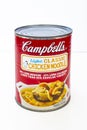 A Campbells Light Classic Chicken Noodle soup on a white background