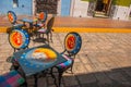 Campeche, Mexico: Table and chairs with a pattern: sun, month, stars, inviting restaurant patios popular with tourists