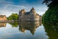 Historic Chateau Trecesson castle in the Broceliande Forest with reflections in the pond Royalty Free Stock Photo