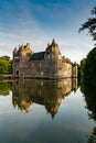 Vertical view of historic Chateau Trecesson castle in the Broceliande Forest with reflections in the pond Royalty Free Stock Photo