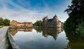 View of the historic Chateau Trecesson castle in the Broceliande Forest with reflections in the pond Royalty Free Stock Photo