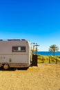 Camper with bicycles on beach, camping on sea