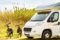 Camper and bicycles camping on nature