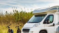 Camper and bicycles camping on nature