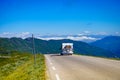 Camper car with bicycles on road Royalty Free Stock Photo