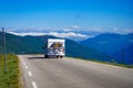 Camper car with bicycles on road Royalty Free Stock Photo