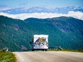 Camper car with bicycles on road Royalty Free Stock Photo