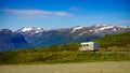 Camper car on road in norwegian mountains