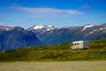 Camper car on road in norwegian mountains