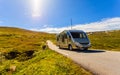 Camper car on road in orwegian mountains