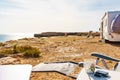 Camper with chair on seaside, camping