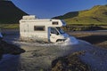 Camper crossing ford, Iceland Royalty Free Stock Photo