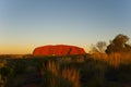 Camper in front of Ayers Rock, Australia. Royalty Free Stock Photo