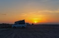 Camper life on the beach. Van\'s camp out on the vast sandy beach