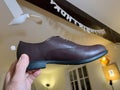 Camper modern female leather shoe in male hand