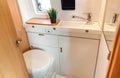 Camper van bathroom interior with toilet Royalty Free Stock Photo