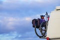 Camper van with bicycles on back rack Royalty Free Stock Photo