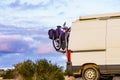 Camper van with bicycles on back rack Royalty Free Stock Photo