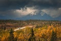 Camper van driving into storm on Richardson Highway in Fall, near Delta Junction, Alaska, USA Royalty Free Stock Photo