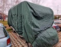 camper van is equipped with a wheel bar behind the towing device.