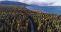 Camper van in foliage forest aerial