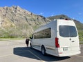 A camper van in front of the Prince of Wales Hotel at Waterton Lake National Park in Waterton Park, AB Canada